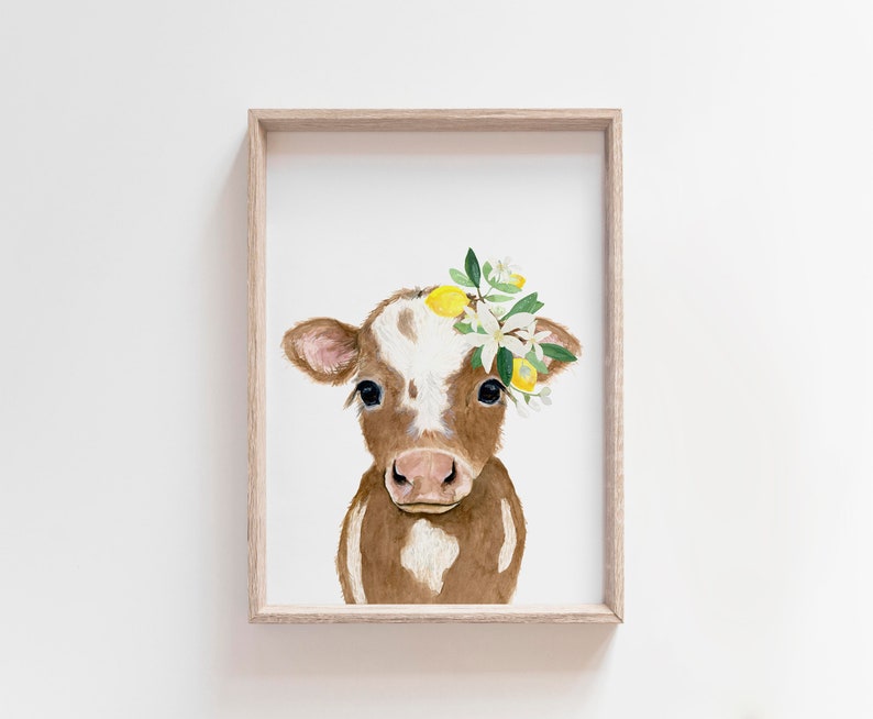 May include: A watercolor painting of a brown and white calf with a wreath of lemons and white flowers on its head.