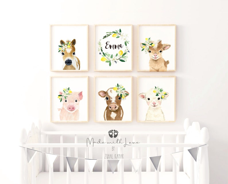 May include: Set of six nursery prints featuring watercolor illustrations of farm animals wearing floral wreaths. The prints include a pig, a cow, a goat, a horse, and two lemon wreaths with the name "Emma" on one.