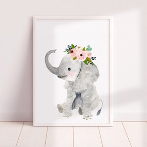 May include: A watercolor illustration of a gray elephant wearing a pink and white flower crown. The elephant is sitting with its trunk raised and its ears spread out.