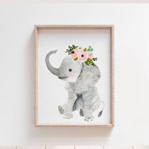 May include: A watercolor painting of a gray elephant wearing a pink and white flower crown. The elephant is sitting down with its trunk curled up. The background is white.