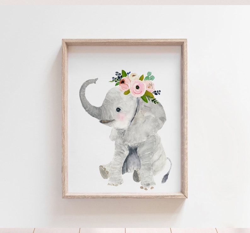 May include: A watercolor painting of a gray elephant wearing a pink and white flower crown. The elephant is sitting down with its trunk curled up. The background is white.