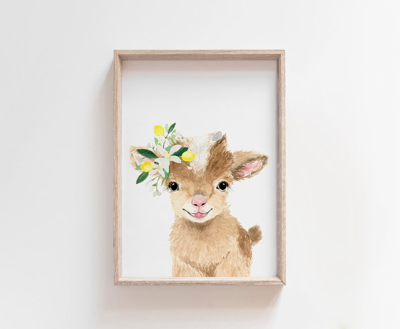 May include: A watercolor painting of a brown baby goat with a white face. The goat is wearing a crown of white flowers and yellow lemons.