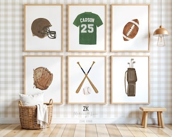 May include: Six framed watercolor prints featuring sports equipment. Included are a football helmet, a green jersey with "Carson 25", a football, a baseball glove, crossed baseball bats with a ball, and a golf bag with clubs. The prints are in wooden frames.