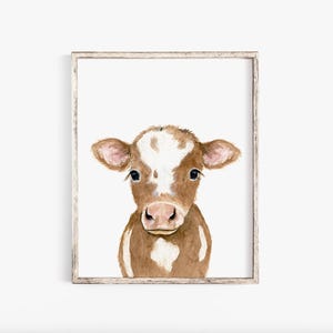 May include: A watercolor painting of a brown and white calf with large, dark eyes. The calf is looking directly at the viewer. The background is white.