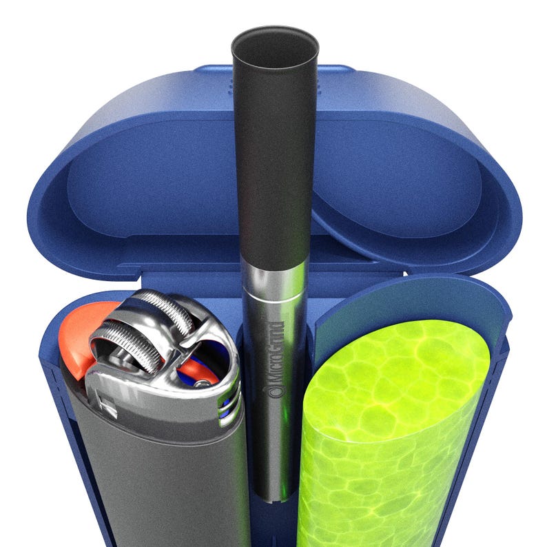 May include: A blue, clamshell-style case containing a black and silver vape pen, a silver lighter with an orange button, and a green, textured cylinder. The vape pen has the text "MicroGland" printed on it.