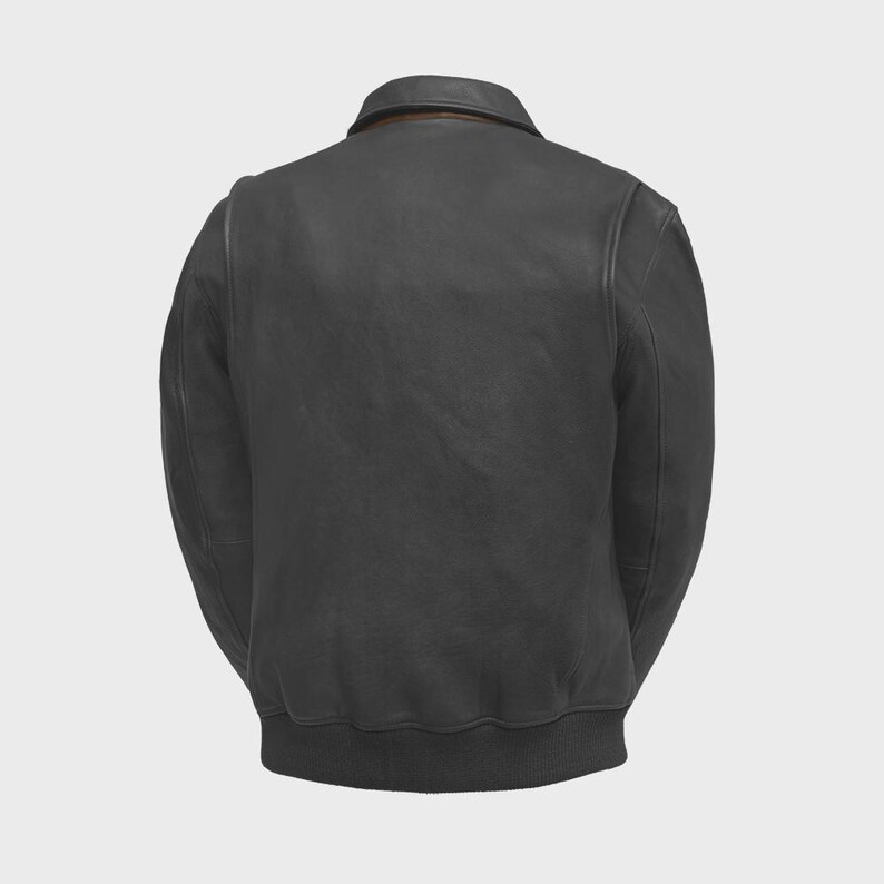 May include: A black leather jacket with a classic bomber style. The jacket features a collar, a ribbed hem, and ribbed cuffs. The back view shows the jacket's design and stitching details. The jacket is a versatile outerwear piece.