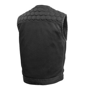 May include: Black vest with a quilted, honeycomb-patterned shoulder area. The vest has a textured, woven fabric on the front and back, and a smooth, dark trim along the edges and bottom. The vest is sleeveless and appears to be designed for protection or support.