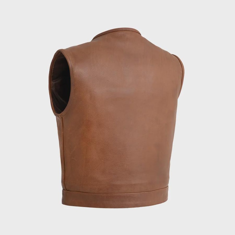 May include: A brown leather vest with a round collar and a sleeveless design. The vest has a smooth texture and a tailored fit. The back view of the vest is shown, highlighting the stitching and the overall shape.