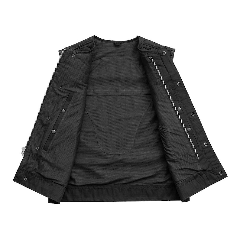 May include: Black vest with a zip-up front and snap closures. The vest has a quilted lining and multiple pockets. The open design reveals the interior lining and stitching details. A classic outerwear piece.