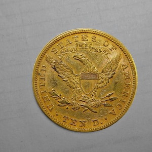 Moneda de 10 dólares del año 1882, cabeza de la Libertad.