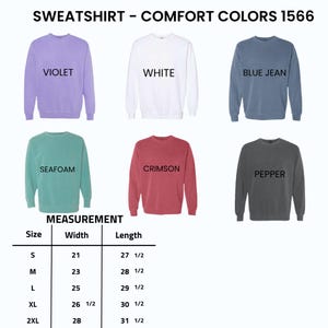 May include: A display of six crewneck sweatshirts in various colors: violet, white, blue jean, seafoam, crimson, and pepper. The image includes a size chart with measurements in inches for width and length, ranging from size S to 2XL.