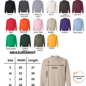 K&ouml;nnte beinhalten: Ein Gildan 18000 Unisex-Sweatshirt in Sandfarbe. Das Bild zeigt eine Vielzahl von Sweatshirt-Farben, darunter Schwarz, Dunkelgrau, Wei&szlig;, Rot, Orange und Gr&uuml;n. Ma&szlig;e sind f&uuml;r die Gr&ouml;&szlig;en S bis 2XL angegeben, mit Breiten von 51 bis 71 cm und L&auml;ngen von 69 bis 79 cm.