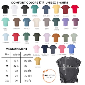May include: A display of Comfort Colors 1717 unisex t-shirts in various colors, including black, white, and blue jean. The image also shows a size chart with measurements in inches, such as 18 1/4 inches width and 26 3/5 inches length for size small.