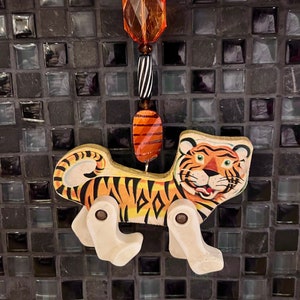 Mid-Century Modern Fisher Price Circus Tiger Repurposed Vintage Christmas Ornament with Vintage Beads and celluloid hanging rings