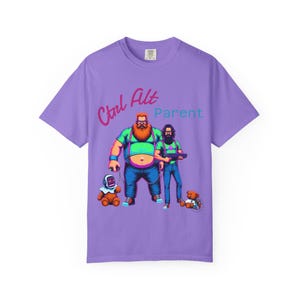 May include: Purple t-shirt with a graphic of two cartoon characters, one with a beard and the other with a mustache, holding a gun. The text "Ctrl Alt Parent" is printed on the shirt.