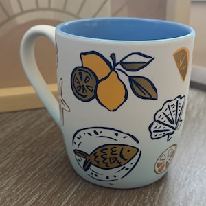 Nautical Ceramic Coffee Mug: Hand-Drawn Fish & Lemon Design