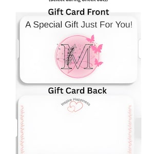 May include: A white gift card with the text "Include a Message with your Gift" and "Gift Card Front". The front of the card has a pink circle with the letter "M" and butterflies. The back says "Gift Card Back" and "Inspire Happiness".
