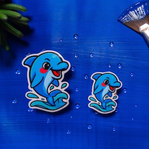Pegatinas de vinilo con diseño de delfines, laminado brillante, en azul y rosa, resistentes al agua, para portátil, botella y diario.