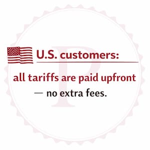 May include: A circular graphic with a red, white, and blue American flag and text that reads "U.S. customers: all tariffs are paid upfront - no extra fees."