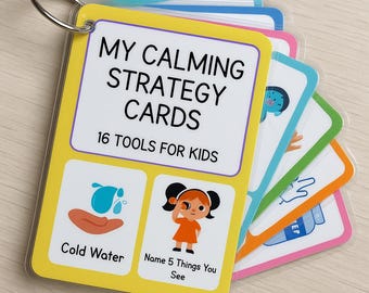 May include: A set of "My Calming Strategy Cards" for kids, held together by a metal ring. The yellow front card reads "My Calming Strategy Cards" and "16 Tools for Kids." The cards feature illustrations and prompts like "Cold Water" and "Name 5 Things You See."