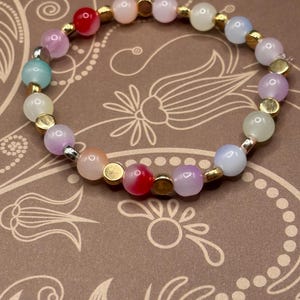 Rainbow/multicolored glass beaded stretch elastic bracelet. Available in several sizes.