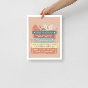 May include: A print featuring a stack of books with romantic quotes and a coffee cup with a crescent moon design. The books are in various colors, with text such as "To Whatever End" and "I've been yours for longer than you could ever imagine."