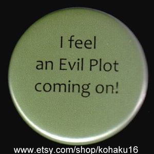 May include: A green button with the text "I feel an Evil Plot coming on!" printed in black.