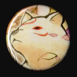 May include: A close-up of a white cat with a red and black mask design. The cat's eyes are closed and it has a pink nose.