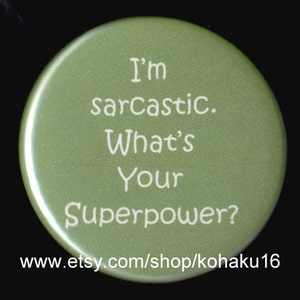 May include: A green round button with white text that reads "I'm sarcastic. What's your superpower?" The text is centered on the button. The button is for sale on Etsy.