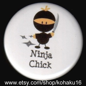 May include: A white button with a cartoon ninja chick holding a sword and throwing throwing stars. The text "Ninja Chick" is printed below the image.