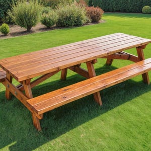 May include: A wooden picnic table with attached benches sits on a green lawn. The table and benches are made of stained wood, with a natural finish. The table is approximately 72 inches long.