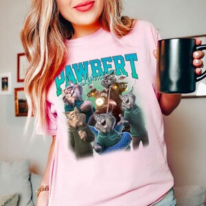 May include: A set of three ceramic mugs with a speckled, matte finish. The mugs are in shades of cream, light gray, and dark gray. Each mug has a simple, minimalist design, perfect for coffee or tea.