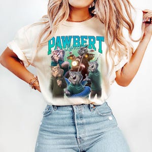 May include: A set of three ceramic mugs with a speckled, matte finish. The mugs are in shades of cream, light gray, and dark gray. Each mug has a simple, minimalist design, perfect for coffee or tea.