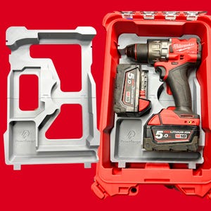 May include: A red Milwaukee FUEL drill and two 5.0 M18 REDLITHIUM-ION batteries are stored in a red case. A grey Printforge insert holds the drill and batteries. A separate grey Printforge insert is on the left.