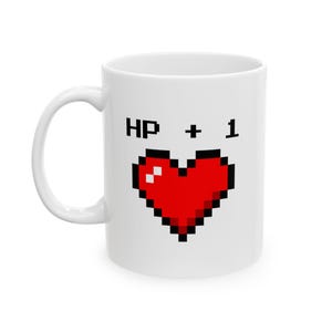 Gamer Ceramic Mug, HP +1 Video Game Reference Coffee Cup, RPG Gamer Gift, 11oz 15oz Tea Mug, Pixelated Heart Design