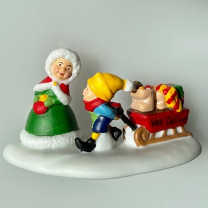 Dept 56: “An Elf Delivers Groceries to Mrs. Claus”, Pulling a Bright Red Sled!! REALLY ADORABLE!