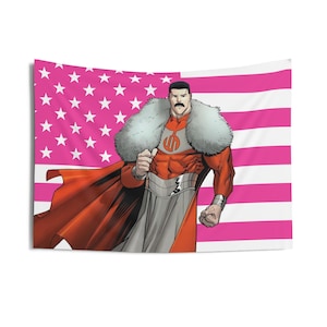 May include: A tapestry featuring a comic book superhero with a red and gray costume, a white fur collar, and a mustache. The background is a pink American flag with white stars and stripes.