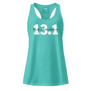May include: A turquoise racerback tank top with the text "13.1 half marathoner" in white. The tank top has a scoop neck and a tag at the back of the neck. The shirt is made of a soft, comfortable material.