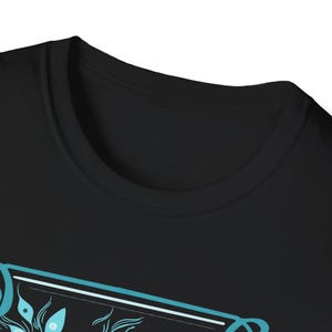 May include: Black t-shirt with a blue and white graphic design featuring a stylized floral pattern. The design includes the text "The Future is Female".
