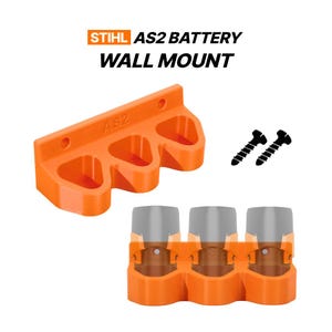 May include: An orange plastic wall mount for Stihl AS2 batteries, featuring three slots and the text AS2 embossed on the front. The set includes two black mounting screws. The text STIHL AS2 BATTERY WALL MOUNT is displayed above the mount.