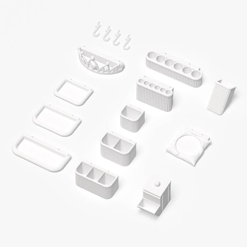 May include: A collection of white, minimalist bathroom organizers and accessories. Includes rectangular trays, toothbrush holders, a soap dish, hooks, and storage containers. The items are arranged on a white surface.