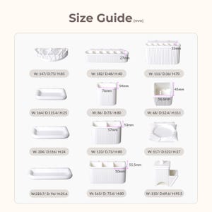 May include: A size guide displays various white plastic organizers with dimensions in millimeters. The guide includes measurements for width, depth, and height, showcasing different shapes and sizes of storage containers, including trays, cups, and divided compartments.