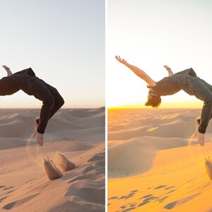 May include: A person performing a backflip over sand dunes at sunset. The person is wearing a dark shirt and pants. The sand is a light tan color, and the sky is a gradient of yellow and orange.
