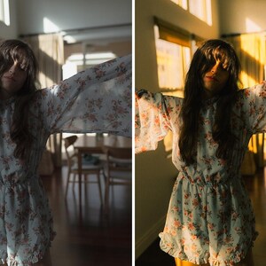 May include: A light blue romper with a floral pattern. The romper has long, flowing sleeves and a ruffled hem. The image is split, with "BEFORE" on the left and "AFTER" on the right, showing a color adjustment.