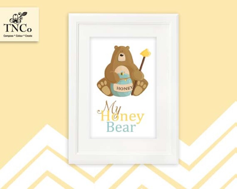 May include: A white framed print with a brown bear holding a honey pot. The text "My Honey Bear" is written in blue and yellow letters.