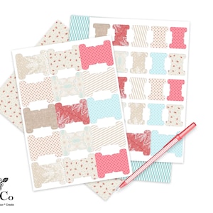 May include: A sheet of printable labels featuring a variety of colorful patterns, including floral, polka dot, and striped designs. The labels are shaped like spools of thread and are perfect for organizing craft supplies.