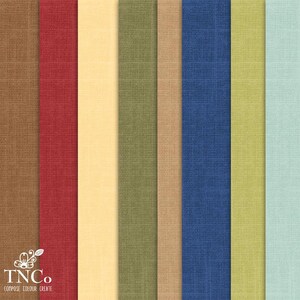 May include: A collection of 10 fabric swatches in various colors, including brown, red, yellow, green, blue, and light blue. The fabric has a textured, woven appearance.