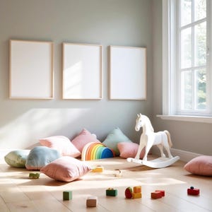 May include: A child's playroom with three framed blank art prints on the wall. A white rocking horse, colourful cushions, and wooden toys are arranged on the wooden floor. A rainbow-shaped wooden toy is also present.