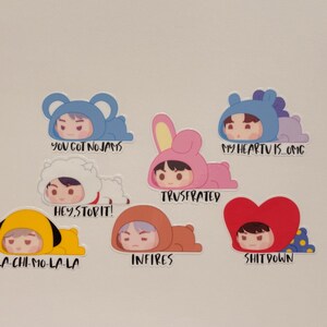 May include: A collection of seven stickers featuring cartoon characters in various animal costumes. Each sticker has a different phrase, including "YOU GOT NO JAMS" and "MY HEARTU IS OMG". The stickers are colorful and have a cute, playful design.