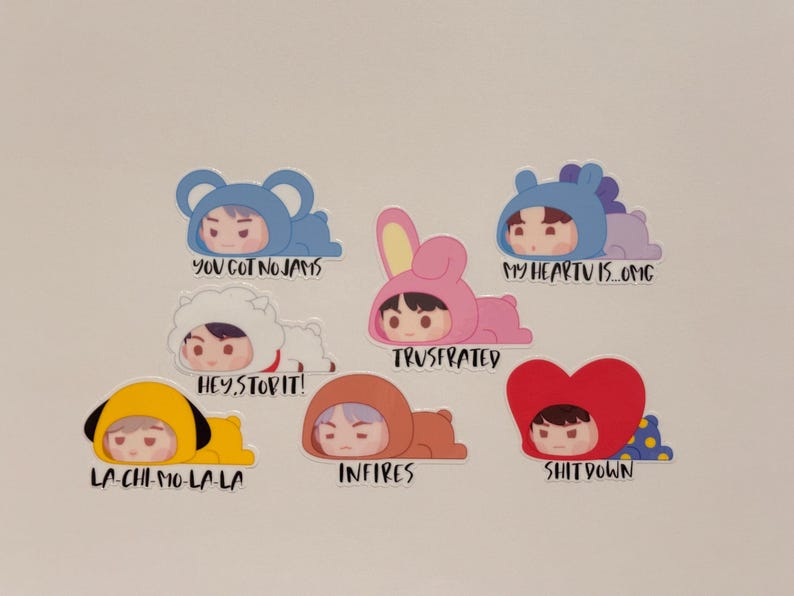 May include: A collection of seven stickers featuring cartoon characters in various animal costumes. Each sticker has a different phrase, including "YOU GOT NO JAMS" and "MY HEARTU IS OMG". The stickers are colorful and have a cute, playful design.